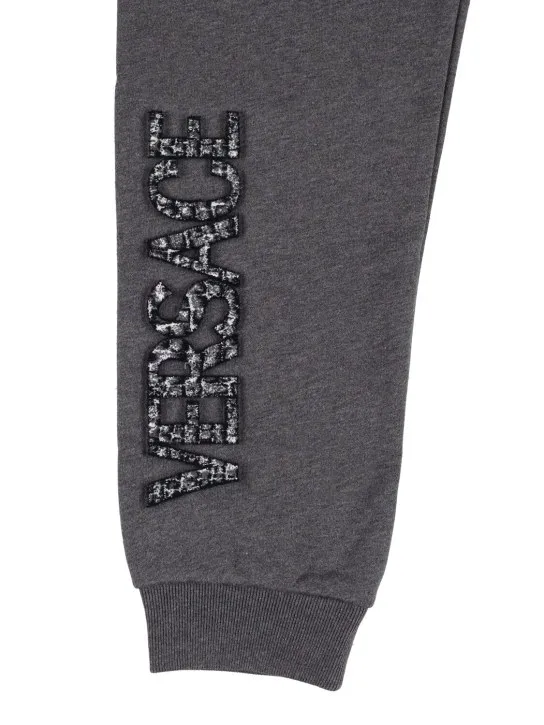 Versace   Embroidered logo cotton sweatpants 
